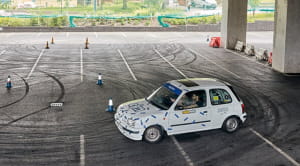 Micra rally car going round cones